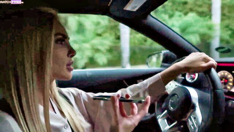 Busty blonde Kenzie Anne driving luxury car, teasing in white top