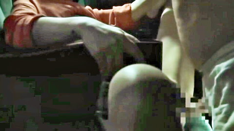 Censored JAV handjob in dark cinema, pale Asian woman in orange top