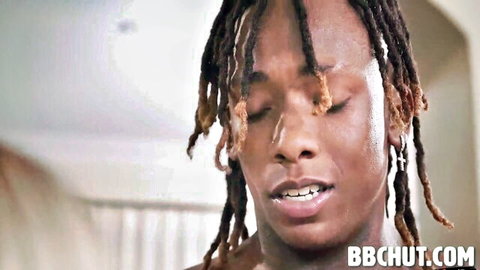 Close-up of intense Black man with dreads in passionate ecstasy