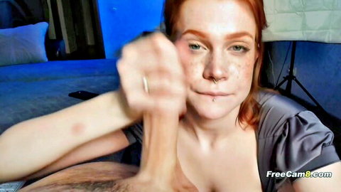 Redhead in satin dress gives handjob until climax on face