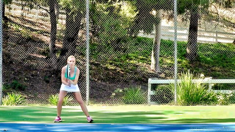 Blonde skinny tennis babe bends over serving in short white skirt teasing small ass and medium tits