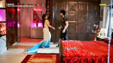 Sensual Indian housewife in flowing saree seducing muscular man in luxurious bedroom