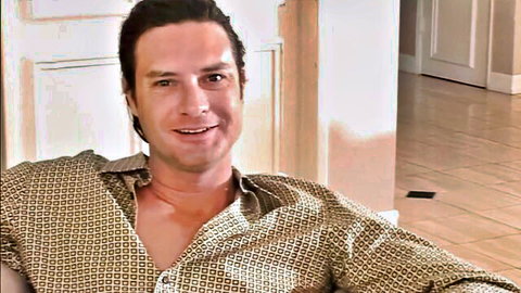 Kayla Synz co-star in open shirt smiling seductively