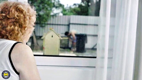 Mature redhead Noretta watches helpful neighbor from window