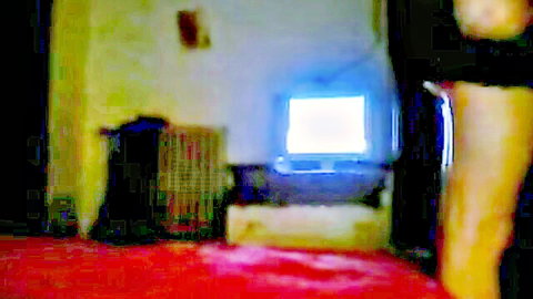 Blurry retro room with woman's sexy black stockinged leg and high heel on red carpet