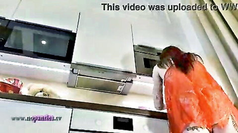 Hot redhead college girl in cotton panties bends over in kitchen showing long legs