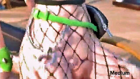 Woman's legs in white fishnet stockings and green harness, Fortnite challenge tease