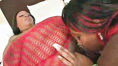 Ebony SSBBW lesbian tongues fat pussy while inserting white dildo near huge natural tits