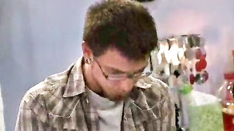 Young man in plaid shirt and glasses looking down, seduced by MILF India Summer