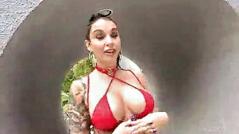 Busty tattooed actress in red bikini, teasing for bukkake and hard anal action