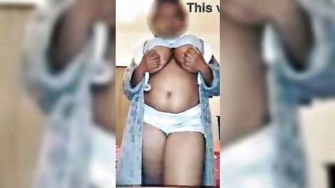 Chubby ebony babe squeezing massive natural tits out of white bra in open robe solo