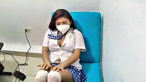 Asian schoolgirl in uniform teases with cleavage in office clinical scene