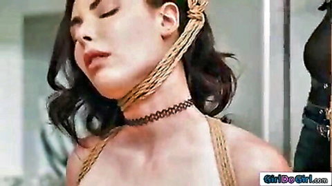 Rope-bound fair-skinned brunette with exposed tits in lezdom bondage ecstasy