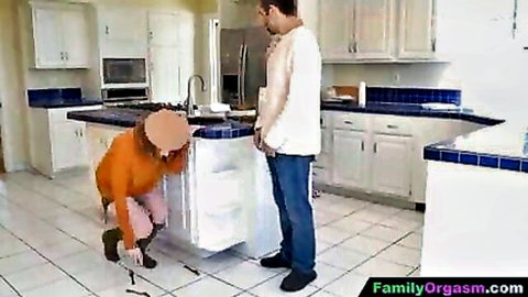 Stepdaughter kneels teasingly before stepdad's bulge in orange sweater
