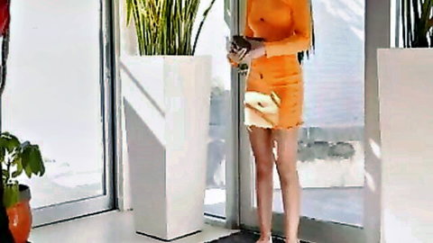 Ameena Green in tight orange mini dress, curvy ebony babe posing seductively