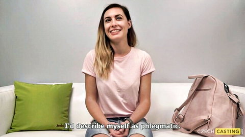 Smiling phlegmatic blonde in pink t-shirt at Czech casting interview