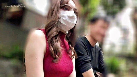 Karina Nishida in red top, glasses and mask with partner outdoors