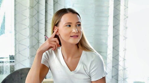 Blonde teen smiling in white v-neck tee for milf and teen threesome scene