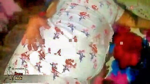 Sri Lankan wife in floral nightie with hands on breasts during couple sex