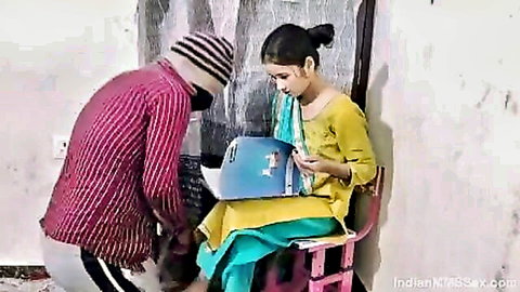 Indian bhabhi in salwar kameez with student over laptop