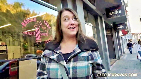 Claudia Macc smiling outside barber shop in Czech Caravan E03