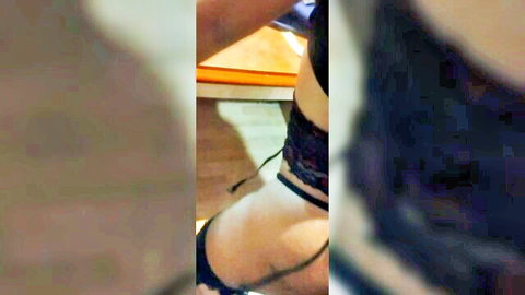 Amateur woman in black lace lingerie showing curvy ass from side