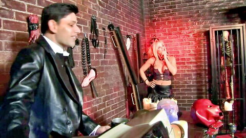 Red latex masked blonde girl in sexy black outfit during horror threesome fuck