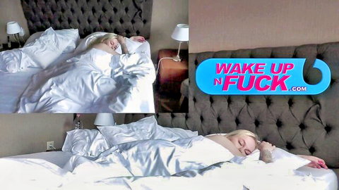 Young blonde sleeping under white sheets in bed with wake up n fuck sign