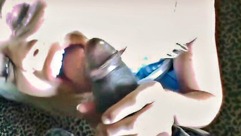 Excited light-skinned babe with mouth wide open sucking thick pierced black dildo