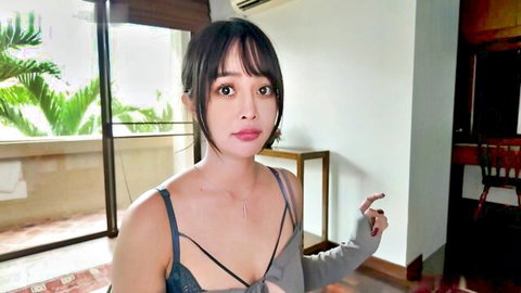 Seductive Chinese girl in black lingerie, teasing pose