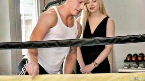Charlyse Angel with muscular trainer in black dress, gym tease