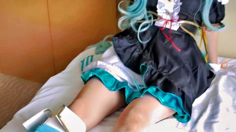 Ardan cosplay girl with teal hair in black frilly dress, showing legs and white socks
