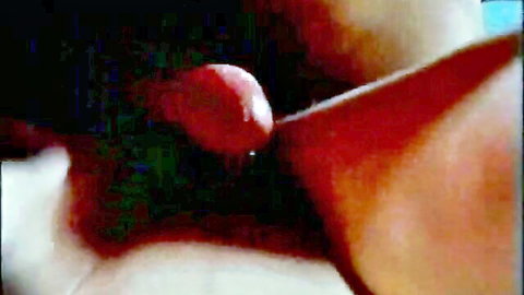 Sensual close-up of blonde licking red cherry in classic XXX tease