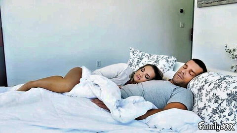 Intimate couple cuddling in bed, kinky family taboo tease