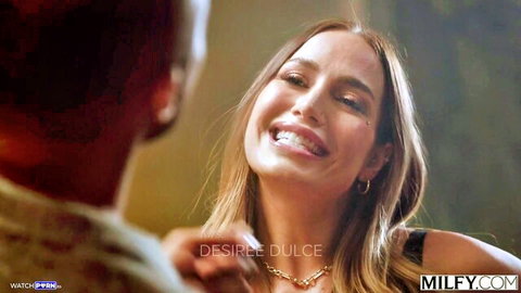 Desiree Dulce smiling seductively with black man in close-up
