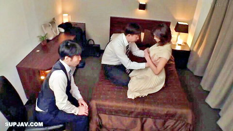 Mino Suzume in JAV threesome tease with suited men on bed