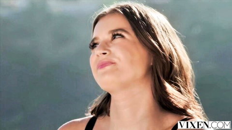 Sky Wonderland petite natural brunette smiling in black top outdoors