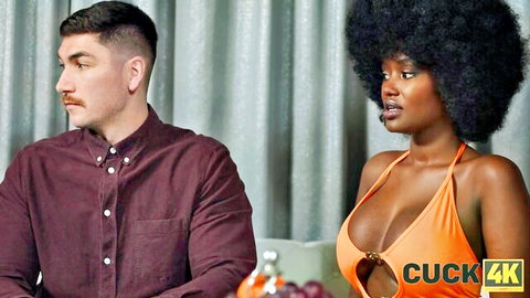 Lexi Luv in orange swimsuit with partner, teasing cuckold scene