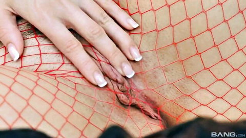 Closeup of shaved pussy stretched by thick cock through torn red fishnet stockings with hands spreading labia