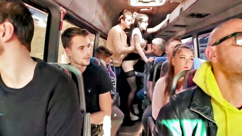 Brunette in black stockings groped by men on crowded public bus orgy