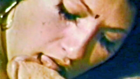 Vintage close-up of aroused Indian woman with bindi in retro XXX peepshow
