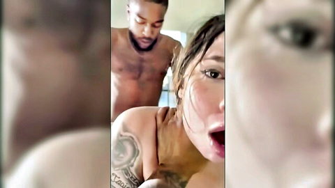 Muscular black guy behind moaning brunette with open mouth in steamy threesome action