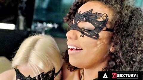 Two masked beauties, ebony and blonde, in teasing lesbian embrace from 21 Sextury