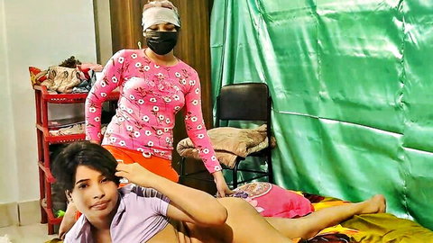 Masked Bangladeshi woman in pink top strokes exposed hard cock of young man on bed