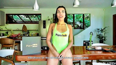 Latina teen in green Pornhub swimsuit pulls crotch aside exposing shaved pussy with vibrator nearby