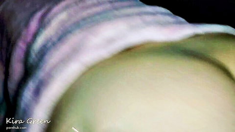 Blurry close-up of woman's pale bare ass cheeks with pink panties pulled down teasingly