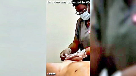Black esthetician laughs as male client cums during waxing session