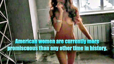Topless brunette with huge bare tits walks seductively in industrial room