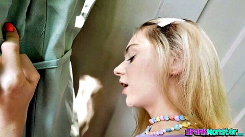 Blonde teen with parted glossy lips and candy necklace in teasing POV blowjob closeup