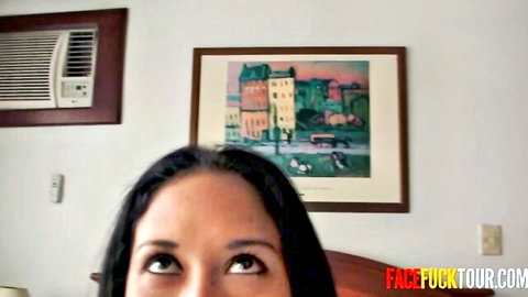 Brunette Latina woman gazes up seductively in intense face fuck scene